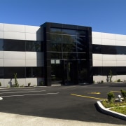 Exterior view of the office building &amp; surrounding architecture, building, commercial building, corporate headquarters, facade, headquarters, property, real estate, black