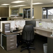 View of the work area which has many desk, furniture, office, product design, brown, black