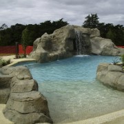 View of the pool area which has a fountain, leisure, swimming pool, water, water feature, water resources, watercourse, waterfall, brown