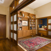 View of this traditional remodeled library space - cabinetry, ceiling, floor, flooring, furniture, hardwood, interior design, living room, real estate, room, wood, wood flooring, brown