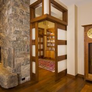 View of this traditional remodeled library space - floor, flooring, hardwood, interior design, living room, lobby, wood flooring, brown