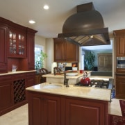 View of a traditional-styled kitchen designed by Pacific cabinetry, countertop, cuisine classique, interior design, kitchen, real estate, room, red, gray