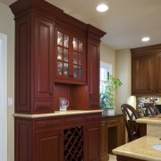 View of a traditional-styled kitchen designed by Pacific cabinetry, countertop, cuisine classique, furniture, hardwood, interior design, kitchen, room, wood stain, red