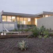 Exterior view of this contemporary home that was architecture, estate, facade, home, house, landscape, property, real estate, residential area, gray, black