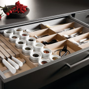 View of kitchen which features innovative storage solutions drawer, furniture, product design, table, black