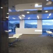 Interior view of an office building with modern ceiling, exhibition, glass, interior design, office, gray, black