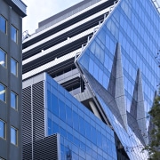 Exterior view of the contemporary Ark building - apartment, architecture, building, city, commercial building, condominium, corporate headquarters, daylighting, daytime, elevation, facade, headquarters, house, landmark, metropolis, metropolitan area, mixed use, residential area, sky, skyscraper, structure, tower block, urban area, window, blue, teal