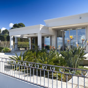 View of the exterior of this modern home cottage, estate, facade, home, house, property, real estate, villa, gray