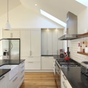 View of renovated kitchen which features timber floors, countertop, cuisine classique, interior design, kitchen, real estate, gray