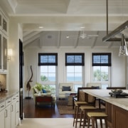 View of a kitchen featuring island, granite countertops, cabinetry, ceiling, countertop, cuisine classique, interior design, kitchen, window, gray