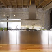 View of a kitchen which features stainless steel ceiling, countertop, cuisine classique, floor, flooring, interior design, kitchen, loft, real estate, wood flooring, brown