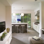 View of kitchen featuring island with CaesarStone countertops, architecture, ceiling, countertop, floor, home, house, interior design, kitchen, living room, real estate, room, table, gray