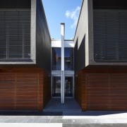 Exterior view of contemporary townhouses. - Exterior view architecture, building, facade, home, house, real estate, residential area, siding, window, black