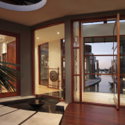 View of the entrance way of this contemporary door, flooring, interior design, property, real estate, window, wood, red, brown