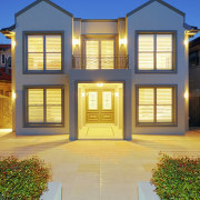 View of this contemporary home - View of building, elevation, estate, facade, home, house, property, real estate, residential area, siding, window, orange