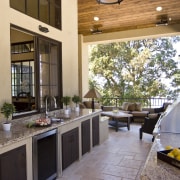 View of outdoor kitchen which features Viking barbeque, countertop, home, interior design, kitchen, property, real estate, window, orange