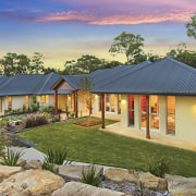 View of this contemporary home by Balmoral Homes backyard, cottage, estate, facade, home, house, landscape, property, real estate, roof, sky, villa, brown