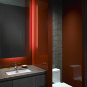 View of this contemporary apartment that has been bathroom, bathroom accessory, ceiling, interior design, lighting, room, red, black