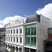 Exterior view of the Drake Hotel which features apartment, architecture, building, city, commercial building, condominium, corporate headquarters, daytime, facade, headquarters, house, metropolitan area, mixed use, neighbourhood, real estate, residential area, sky, blue