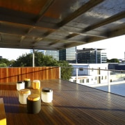 View of the outdoor covered deck on the apartment, architecture, balcony, daylighting, deck, estate, house, interior design, outdoor structure, penthouse apartment, property, real estate, roof, wood, black, brown