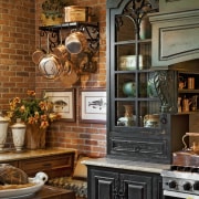 View of a traditional European-styled kitchen which features cabinetry, countertop, home, interior design, kitchen, room, brown