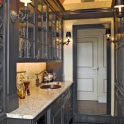View of a traditional European-styled kitchen which features cabinetry, ceiling, countertop, cuisine classique, interior design, kitchen, black