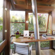 Interior view of contemporary tree house which features ceiling, dining room, furniture, home, house, interior design, real estate, room, table, window, wood, brown