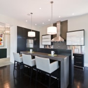 View of kitchen area that features cafe-styled bar, dining room, interior design, kitchen, real estate, room, white