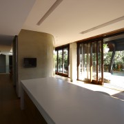 View of kitchen area featuring hardwood flooring, island architecture, daylighting, estate, home, house, interior design, property, real estate, window, black