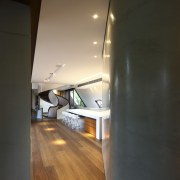 View of kitchen area featuring hardwood flooring, island architecture, ceiling, daylighting, floor, flooring, hardwood, home, house, interior design, laminate flooring, light, light fixture, lighting, wall, wood, wood flooring, black, brown