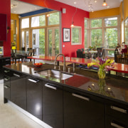 View of kitchen with red feature wall, red countertop, interior design, kitchen, real estate
