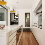 Glazed walls. Wood floors and decking. Island calacatta architecture, ceiling, countertop, floor, flooring, hardwood, house, interior design, kitchen, laminate flooring, wood flooring, white