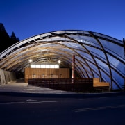 View of the canopy at the Waitomo Caves arch, architecture, building, corporate headquarters, daylighting, evening, facade, fixed link, landmark, metropolitan area, night, residential area, sky, structure, black, blue