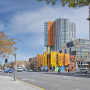 Exterior view of the Altitude in the Precinct architecture, building, city, commercial building, condominium, daytime, downtown, facade, infrastructure, landmark, metropolis, metropolitan area, mixed use, neighbourhood, real estate, road, sky, skyscraper, street, tower block, tree, urban area, gray, teal