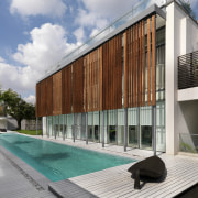 View of the outdoor area which features a apartment, architecture, building, condominium, corporate headquarters, facade, house, mixed use, property, real estate, gray