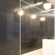 View of brass walls fabricated by Craft Metals door, flooring, glass, interior design, lobby, wall, black, white