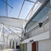 Singer Group undertook the broad array of electrical architecture, building, corporate headquarters, daylighting, daytime, facade, metropolitan area, real estate, roof, sky, structure, gray