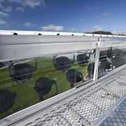 View of the roof of the south stand architecture, cloud, fixed link, reflection, roof, sky, structure, water, gray, blue