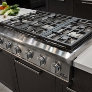 View of a kitchen which features DCS oven countertop, gas stove, home appliance, kitchen, kitchen appliance, kitchen stove, black, gray
