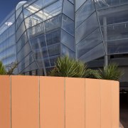 view of Eden Park which features precast concrete architecture, building, corporate headquarters, daylighting, facade, line, structure, orange