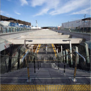 View of stairway with stainless steel handrails at building, cloud, ferry, reflection, sky, vehicle, water, black, teal