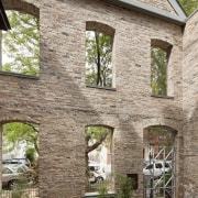 View of a renovated three-story home, built to brick, cottage, estate, facade, home, house, property, real estate, window, brown, gray