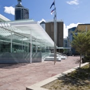 Civil engineering contracting company John Fillmore Contracting was architecture, building, city, corporate headquarters, daytime, plaza, sky, structure, gray, teal