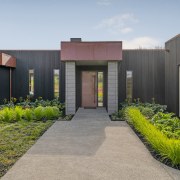 A strong entrance form with copper clad door 