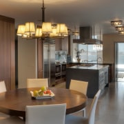 View of contemporary kitchen and dining area with cabinetry, countertop, cuisine classique, dining room, interior design, kitchen, real estate, room, table, brown, gray
