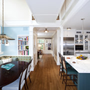 View of kitchen with dark turquoise island, colorful architecture, ceiling, daylighting, dining room, floor, flooring, hardwood, house, interior design, kitchen, living room, real estate, room, table, wood, wood flooring, white, brown