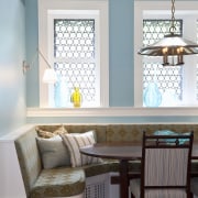 View of kitchen with dark turquoise island, colorful dining room, furniture, home, interior design, living room, room, table, wall, window, window covering, window treatment, white