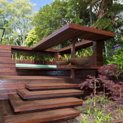 View of timber outdoor seating area with large backyard, home, house, outdoor structure, plant, tree, wood, red