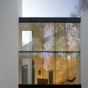 Exterior view of a contemporary house that features architecture, building, daylighting, facade, glass, home, house, window, gray