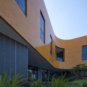 Exterior view of the Poche Centre which was architecture, building, corporate headquarters, elevation, facade, home, house, real estate, residential area, sky